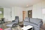 Wohn/ Essbereich mit Couch, Sessel und Tisch - Aparthotel Anna Düne 2-39 - Top-Hundeurlaub