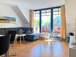 Wohnzimmer mit Zugang zum Balkon - Wohnung 14-6 - Top-Hundeurlaub