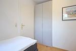 erstes Schlafzimmer mit Einzelbetten und Kleiderschrank - Wohnung 14-6 - Top-Hundeurlaub