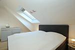zweites Schlafzimmer mit Boxspringbett - Wohnung 14-6 - Top-Hundeurlaub