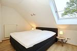drittes Schlafzimmer mit Boxspringbett - Wohnung 14-6 - Top-Hundeurlaub