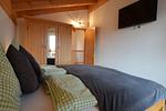 Schlafzimmer - Bernhard - Feriendorf Via Claudia Haus 62 - Top-Hundeurlaub