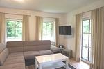 Wohnzimmer - Birkenstraße 11c Haus 2 - Top-Hundeurlaub