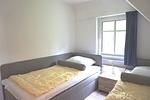 Schlafzimmer - Birkenstraße 11c Haus 2 - Top-Hundeurlaub