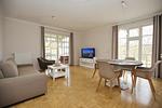 Wohnzimmer mit Blick zur Terrasse - Wohnung 03 - Top-Hundeurlaub