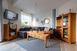 Wohnzimmer - Ferienhaus  Achteck am Deich, Graureiherweg 4a - Top-Hundeurlaub