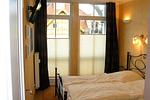 Schlafzimmer mit Doppelbett - Dünenschloss 1-28 - Top-Hundeurlaub