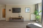 Ferienwohnung Godewind Aparthotel Zingst - Blick auf den Tv im Wohnzimmer - Godewind - Top-Hundeurlaub