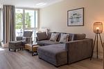 Ferienwohnung Godewind Aparthotel Zingst - gemütliche Couch im Wohnzimmer - Godewind - Top-Hundeurlaub