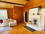 Wohnzimmer mit Kamin im Ferienhaus Sommerlycka - Haus Sommerlycka - Top-Hundeurlaub