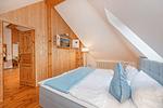 Schlafzimmer - Ferienhaus Rad Kapitän direkt am See mit Sauna und Terrasse - Top-Hundeurlaub