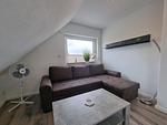 Wohnzimmer - Ferienwohnung Nordwind Neßmersiel - Top-Hundeurlaub
