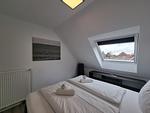 Schlafzimmer - Ferienwohnung Nordwind Neßmersiel - Top-Hundeurlaub