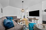 Wohnzimmer - Ferienwohnung Perfekte Welle Olpenitz - Top-Hundeurlaub