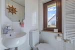 Gästebad mit Toilette und Waschbecken - Hafenhaus Kapitänsdeck - Top-Hundeurlaub