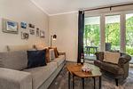 Wohnzimmer - Ferienwohnung Terrasse am Haff mit Wellnessbereich, Sauna und großen Balkon - Top-Hundeurlaub