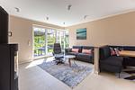 Helles Wohnzimmer mit Zugang zur Terrasse - Windlooper 2 - Top-Hundeurlaub