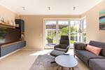 Modernes Wohnzimmer mit sofa und TV - Windlooper 2 - Top-Hundeurlaub