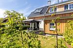 Terrasse mit Sitzbereich und Sonnenschirm - Windlooper 2 - Top-Hundeurlaub