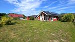 Garten - Ferienhaus "Kiek Ut" im Ferienpark Holm an der Ostsee - Top-Hundeurlaub