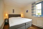 Schlafzimmer mit Doppelbett - Wohnung 02-1 - Top-Hundeurlaub