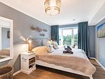 Schlafzimmer 1: Doppelbett (180x200), TV - FeWo Aquarius in PRORA - 4.41 - Top-Hundeurlaub