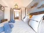 Schlafzimmer 1: Doppelbett (180x200), TV - FeWo Aquarius in PRORA - 4.41 - Top-Hundeurlaub