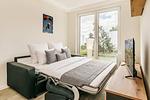Schlafzimmer - Ferienwohnung Labiland am Haff mit Terrasse und Haffblick - Top-Hundeurlaub