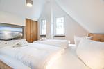 Schlafzimmer - Ferienhaus Baltic Huus mit Sauna, Kamin und Sonnenterrasse - Top-Hundeurlaub