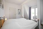 Schlafzimmer mit Zugang zum Balkon - Wohnung 15 - Top-Hundeurlaub