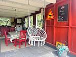 Große überdachte Veranda mit Sitzplätzen am Hus Långhult - Hus Långhult - Top-Hundeurlaub