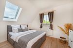 Schlafzimmer - Ferienhaus Wiesenblick mit Kamin, Terrasse, Badewanne und Dusche - Top-Hundeurlaub