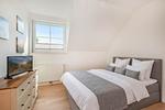 Schlafzimmer - Ferienhaus Wiesenblick mit Kamin, Terrasse, Badewanne und Dusche - Top-Hundeurlaub