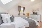 Schlafzimmer - Ferienhaus Wiesenblick mit Kamin, Terrasse, Badewanne und Dusche - Top-Hundeurlaub