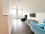 Wohnzimmer mit TV im 2. OG mit Blick aufs Meer und Loggia - Inselblick (E014) - Top-Hundeurlaub