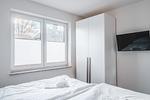Schlafzimmer - Dünenquartier Apartment 01 - Top-Hundeurlaub