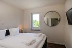 Schlafzimmer - Dünenquartier Apartment 04 - Top-Hundeurlaub