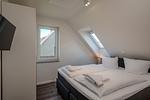Schlafzimmer - Dünenquartier Apartment 04 - Top-Hundeurlaub