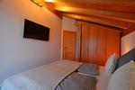 Schlafzimmer 2 mit TV - Alpenrose - Feriendorf Via Claudia Haus 53 - Top-Hundeurlaub