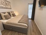Zweites Schlafzimmer mit Doppelbett und Smart TV - Graftblick am Meer (48.0.S) - Top-Hundeurlaub