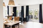 Wohnzimmer mit TV und Blick aufs Wasser - Graftblick am Meer (48.0.S) - Top-Hundeurlaub