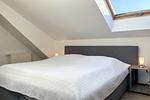 zweite Schlafzimmer im Dachgeschoss mit Doppelbett - Wohnung 07-7 - Top-Hundeurlaub