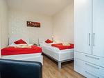 Schlafzimmer mit zwei Einzelbetten - Wohnung 2.1 - Möwennest - Top-Hundeurlaub