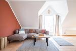 Gemütliches Wohnzimmer mit Sofa und Couchtisch - Strandoase - Wohnung 3 - Top-Hundeurlaub