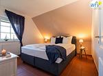 Schlafzimmer - Ferienwohnung Sonnenrose - Top-Hundeurlaub