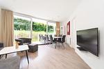 Wohnzimmer mit Blick zur Terrasse - Wohnung 02 - Top-Hundeurlaub
