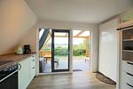 Küche / Küchenzeile - Modernes Nurdachhaus in ruhiger Feriensiedlung direkt am Wittensee mit Seeblick - Top-Hundeurlaub
