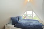 Schlafzimmer - Modernes Nurdachhaus in ruhiger Feriensiedlung direkt am Wittensee mit Seeblick - Top-Hundeurlaub