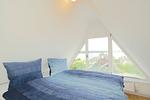 Schlafzimmer - Modernes Nurdachhaus in ruhiger Feriensiedlung direkt am Wittensee mit Seeblick - Top-Hundeurlaub