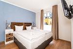 Schlafzimmer mit Doppelbett - Wohnung 03 - Top-Hundeurlaub